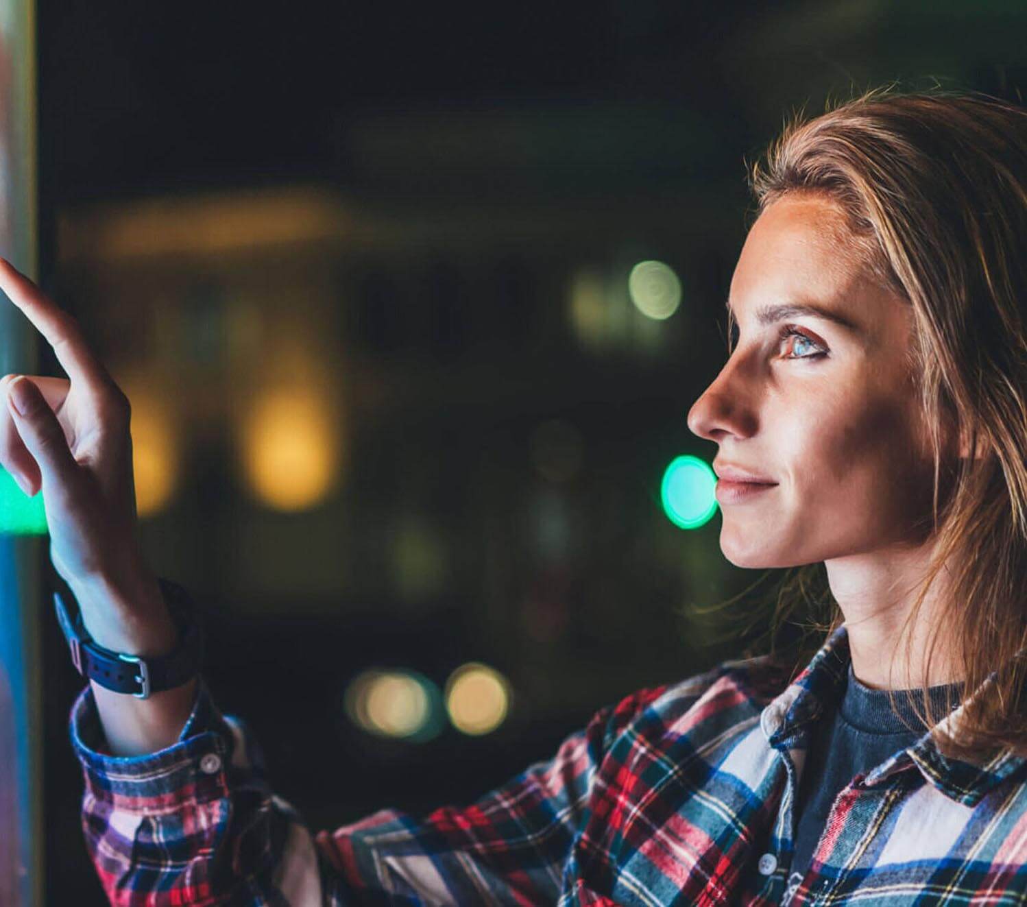 girl pointing finger to blank monitor display, hipster touch multimedia technology on light night city, click media lcd device, mockup screen information gadget