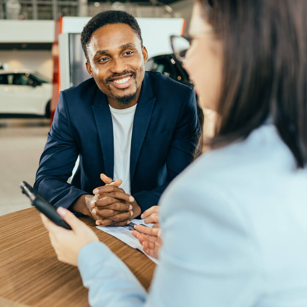 Salesperson helping a customer in a dealership