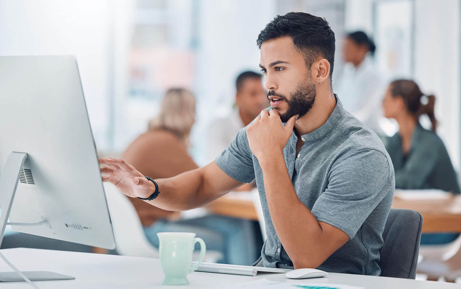 Startup, office and man at desk with computer working on creative project for marketing or advertising business. Businessman, graphic designer or software developer working on digital transformation.