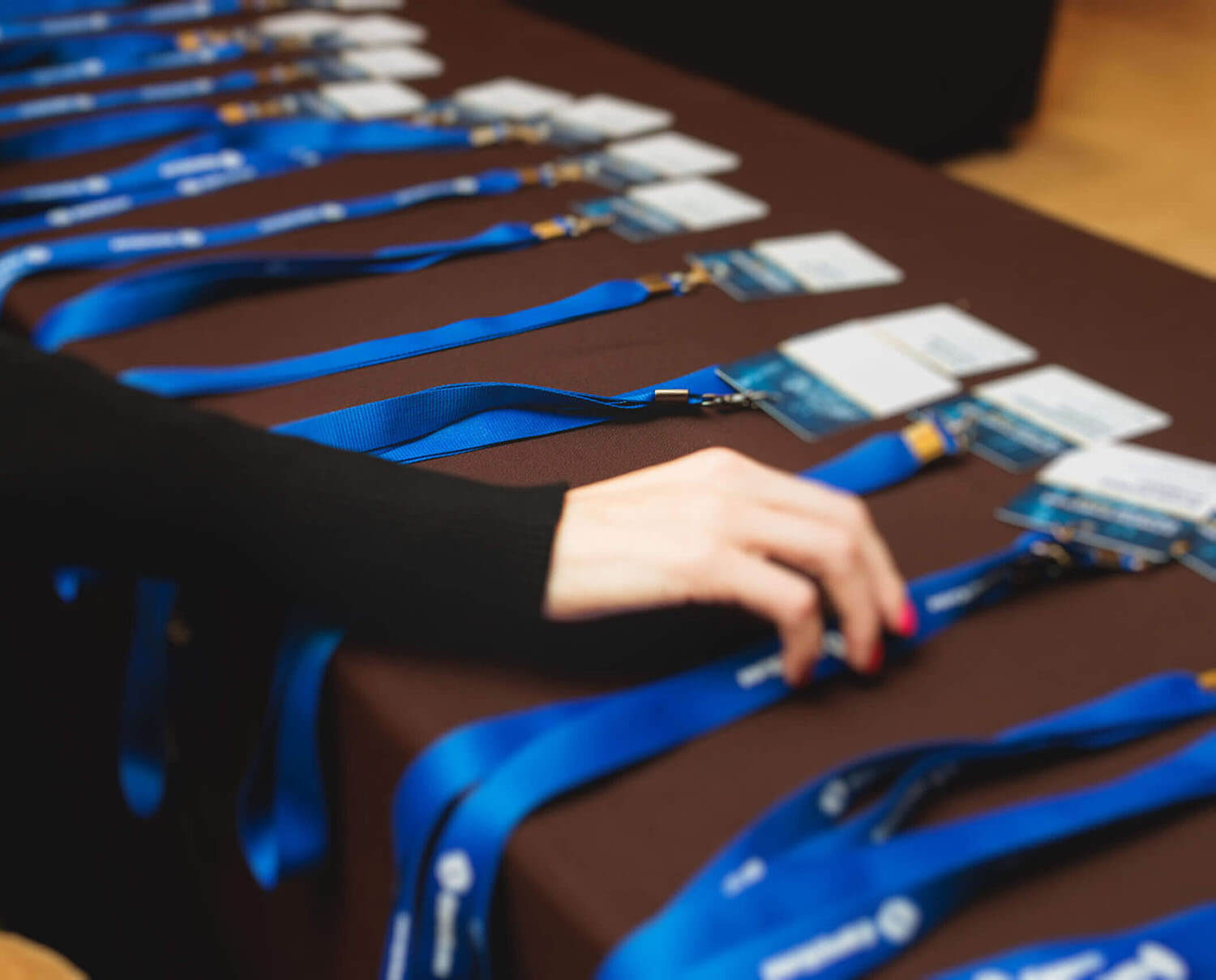 rows of lanyards at conference registration